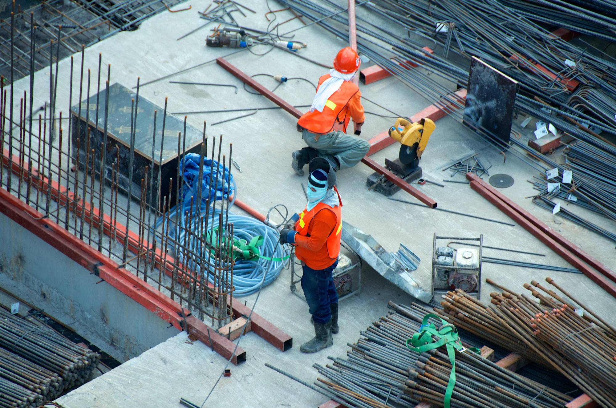 Construction workers installing structural steel